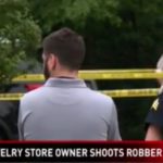 Robber shot and killed