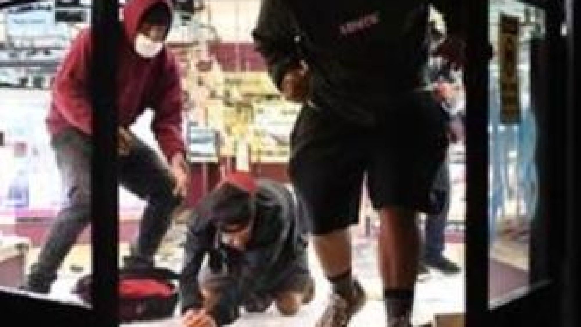 Image of people looting.